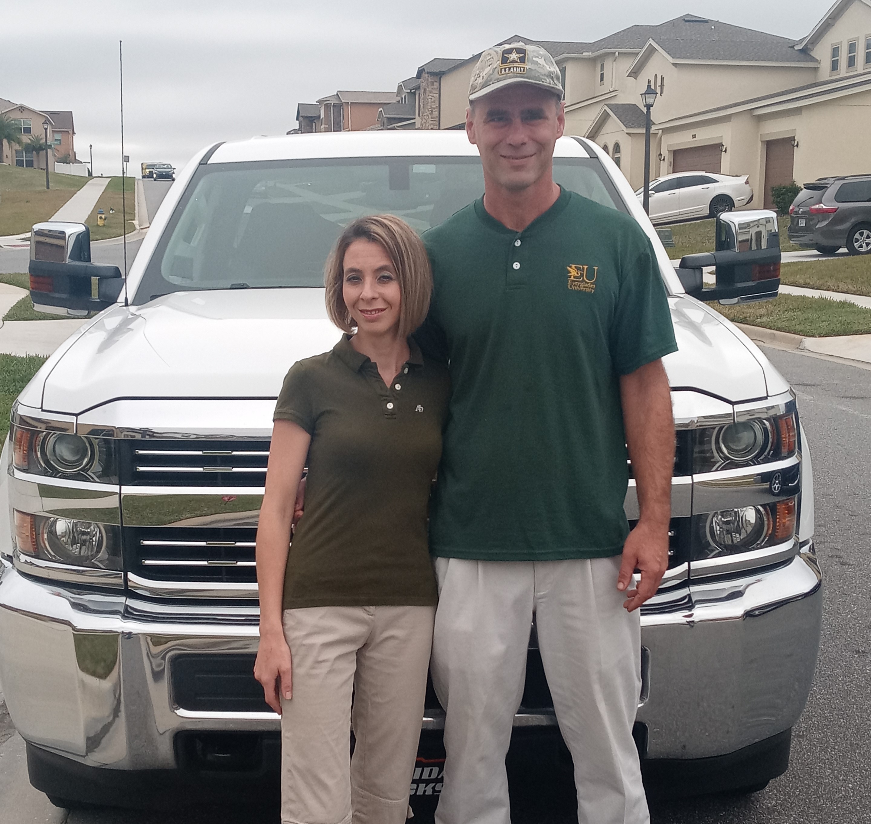 Mike and Gina in front of their irrigation truck